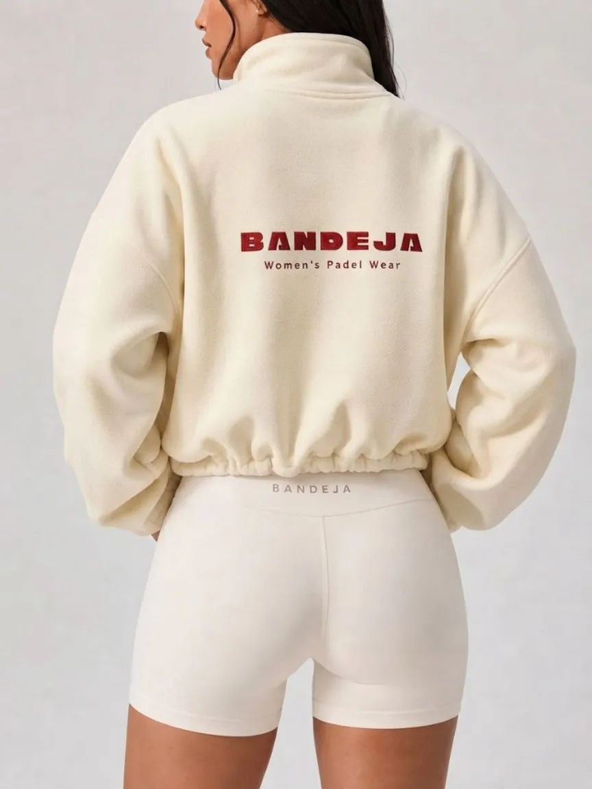 Butter Jacket in Butter Yellow — back, stitched logo