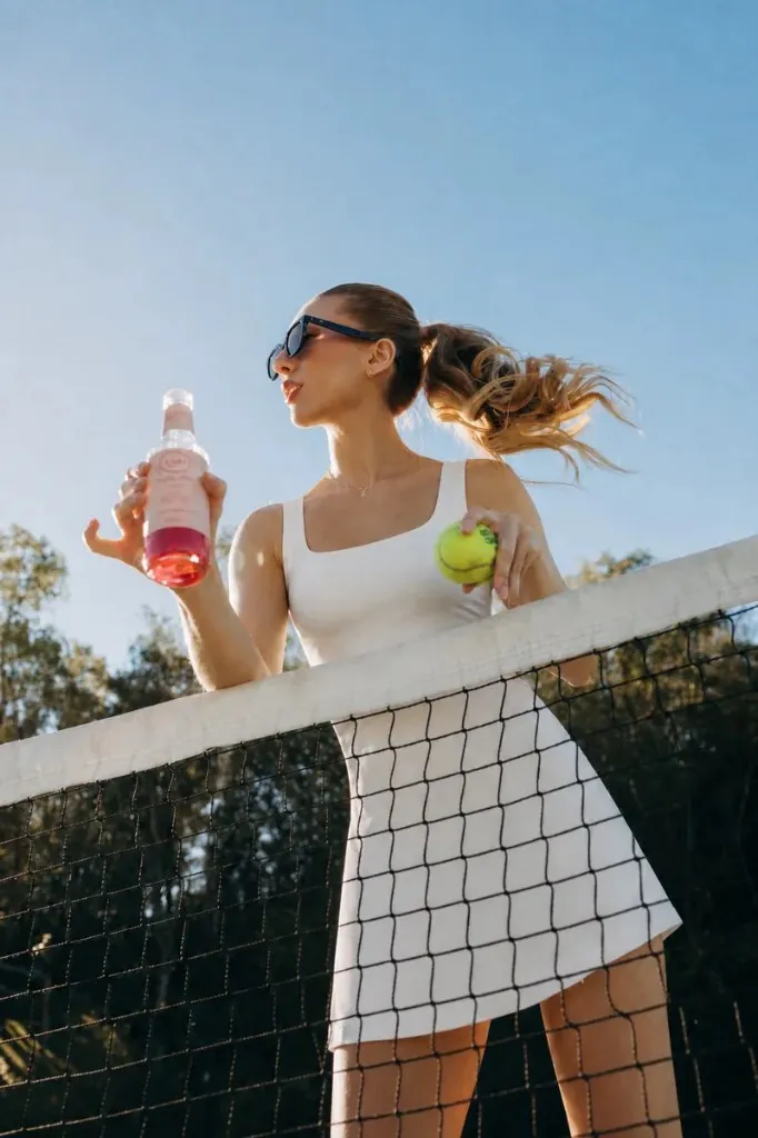Court Dress in Bone, drink and ball at the net